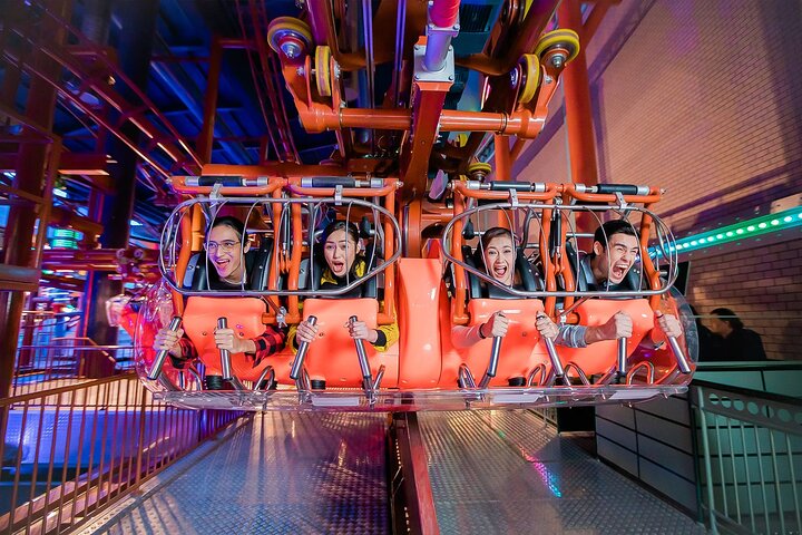 Family enjoying indoor theme park attractions in Genting