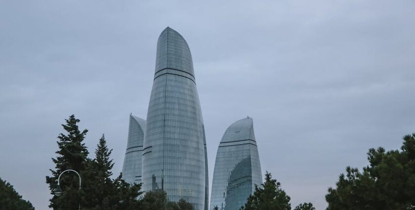 Flame Towers in Baku covered with snow during winter with clear blue sky