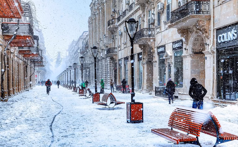 Old City Baku Icherisheher with snow falling on ancient stone walls