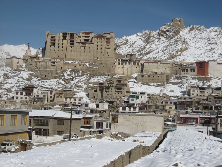 Leh Palace covered in snow with clear blue sky in winter