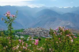 Spiti Valley in April showing snow-covered mountains with blue sky