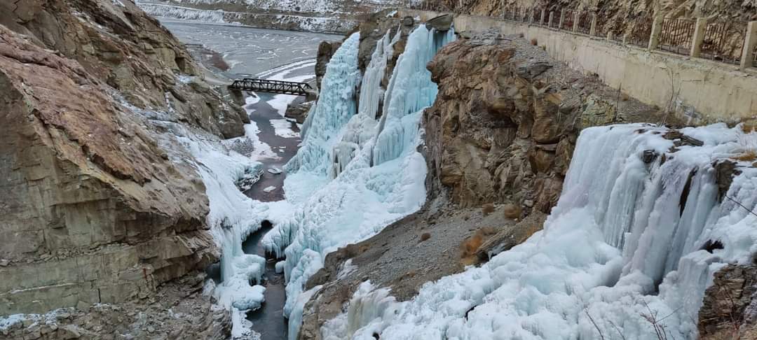 Frozen Spiti River with ice formations and snow covered banks