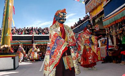 Monks performing sacred cham dance during Gustor Festival