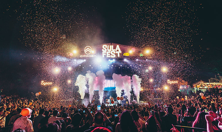 Audience dancing during evening music set at SulaFest
