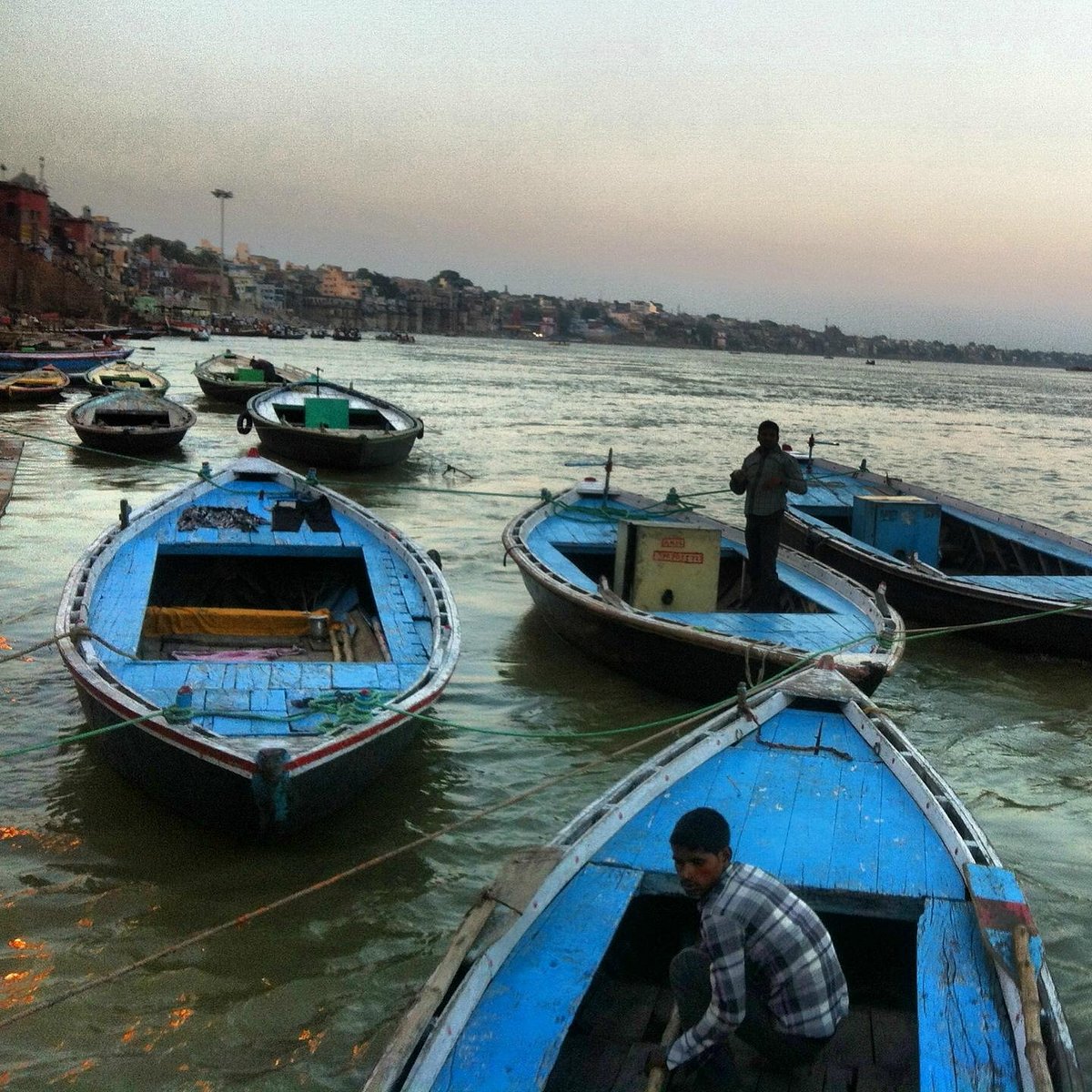 Boat ride on Ganges at sunrise - View of Varanasi ghats from the river