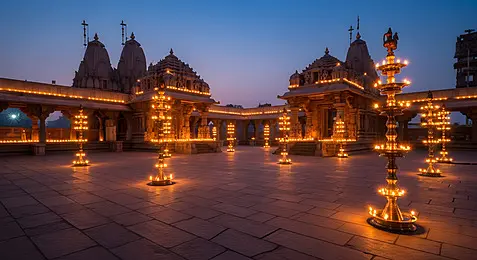 Evening lamps in a Tamil Nadu temple courtyard