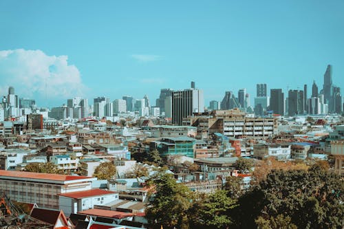Bangkok skyline and Thai beach destination collage