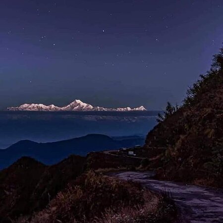 Majestic Kangchenjunga peak at sunrise with golden light