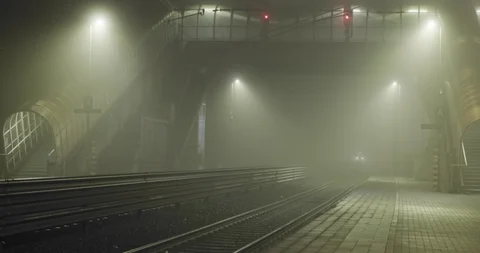 Foggy railway station with low visibility