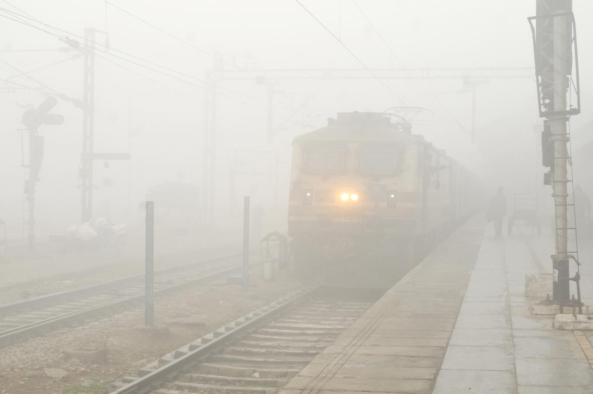 Train moving slowly in dense fog conditions
