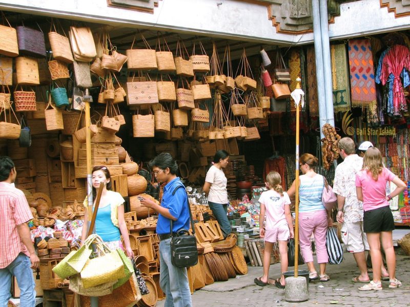 Travelers bargaining politely at Ubud Art Market Bali