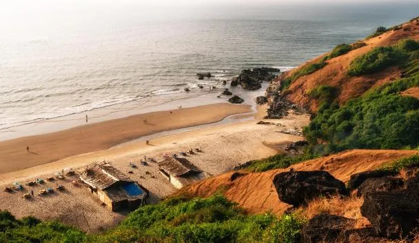 Vagator Beach coastline with red cliffs and Arabian Sea views in North Goa