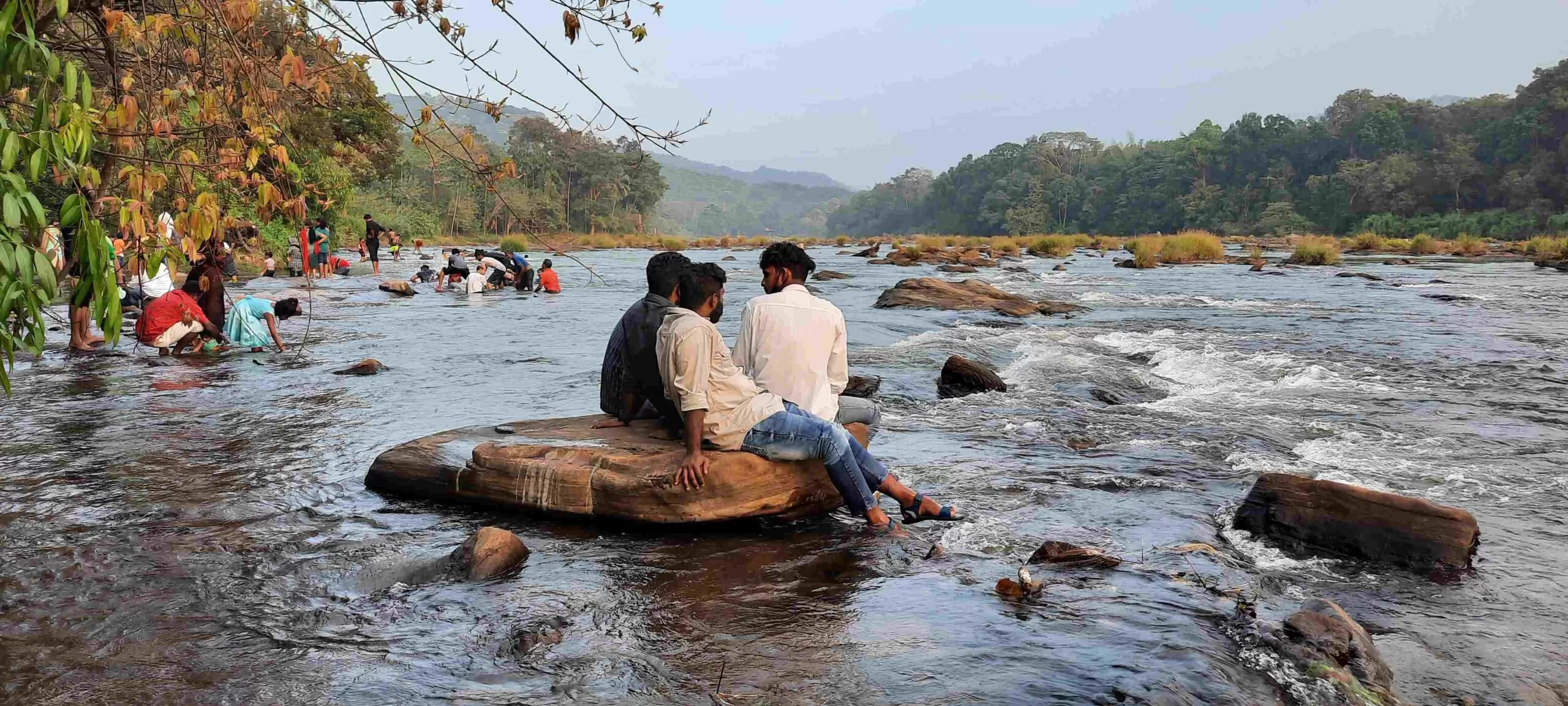 On-ground safety checklist at Vazhachal Waterfalls with wet-rock caution