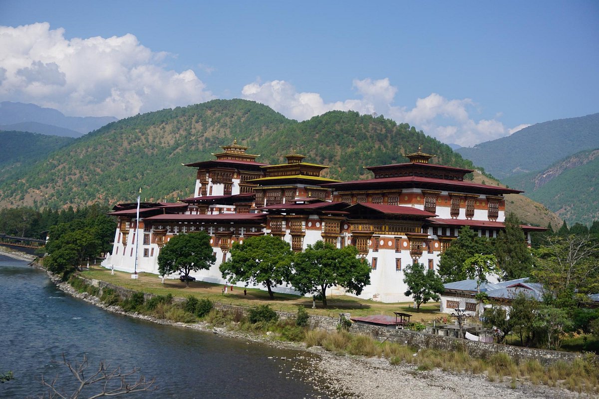 Wangdue Phodrang Dzong with traditional Bhutanese architecture on ridge top