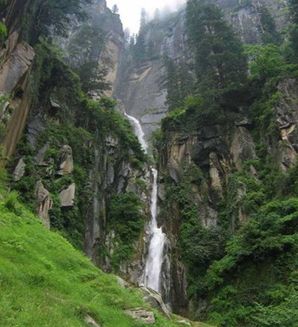 Jogini Waterfall near Vashisht in Manali with mountain backdrop