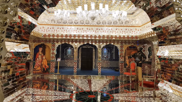 Family photo section with wax figures in Udaipur museum