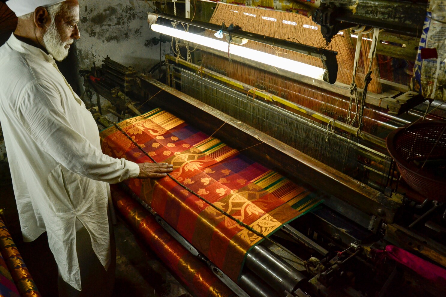 Close-up of Banarasi brocade weaving with zari work on handloom