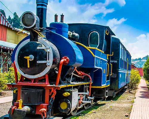 Darjeeling Toy Train against mountain backdrop