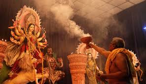 Elaborate Durga Puja pandal with illuminated decorations