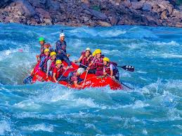 Rafting team navigating rapids on Ganga River