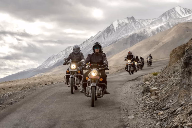 Motorcyclists riding through Zanskar Valley mountains