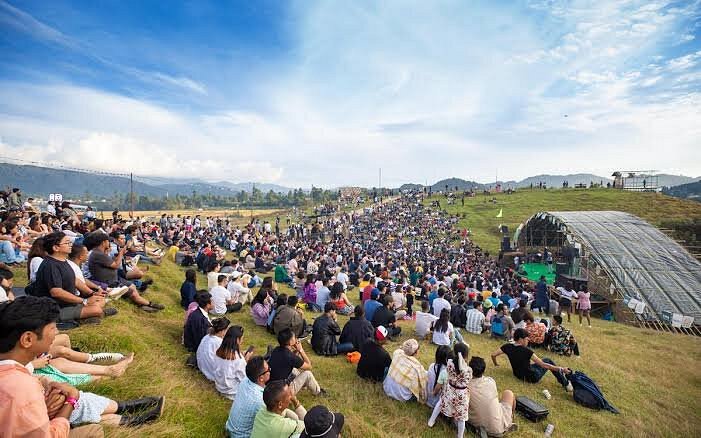 Ziro Music Festival valley venue with stage and mountains